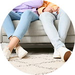 A man and woman sitting on a couch