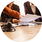 Lawyers and clients engaged in discussion around a conference table